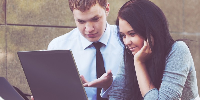 Young couple with laptop.